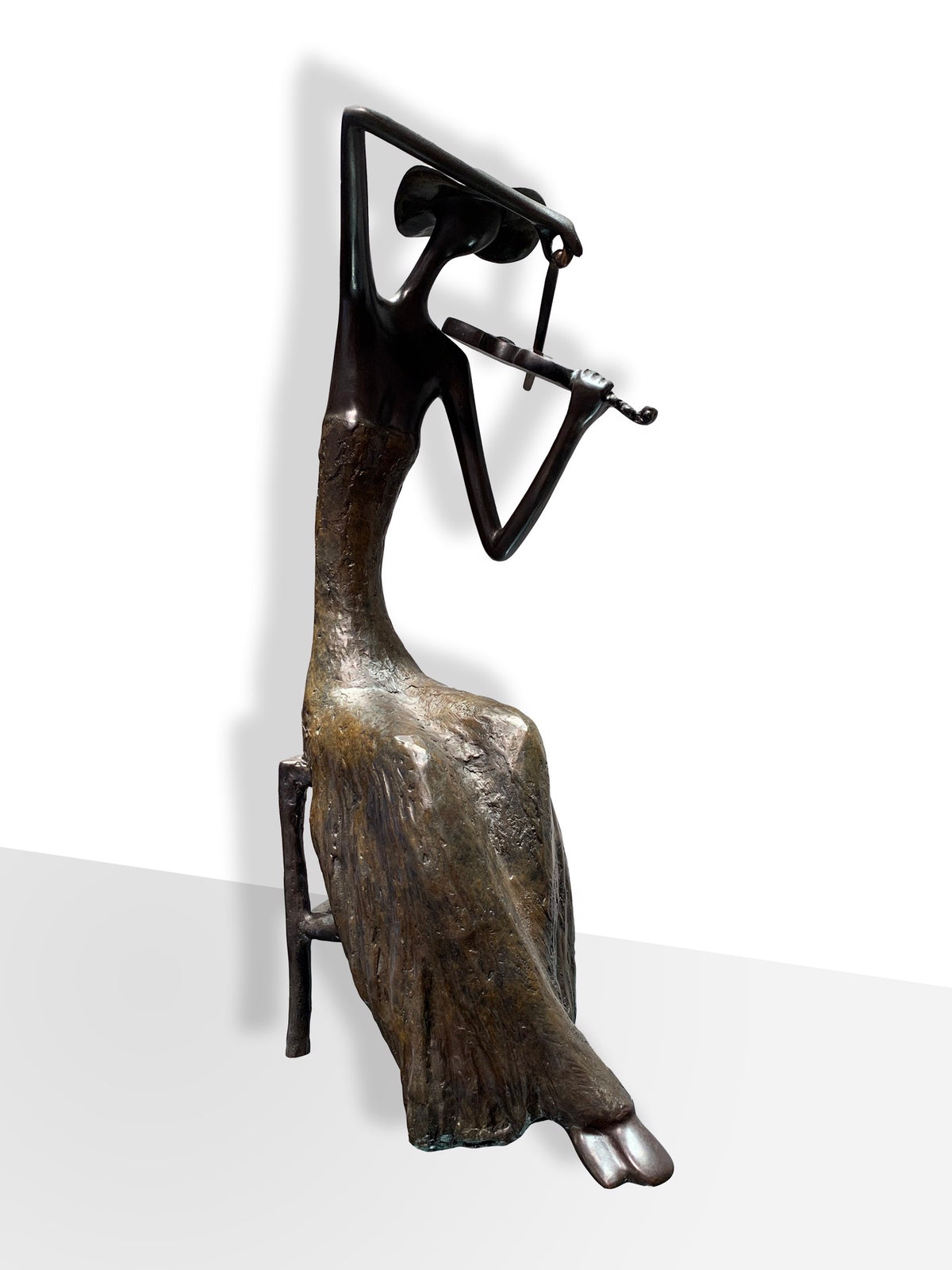 Bronze sculpture of an abstract figurine playing a violin while seated, with elongated arms and a flowing dress.