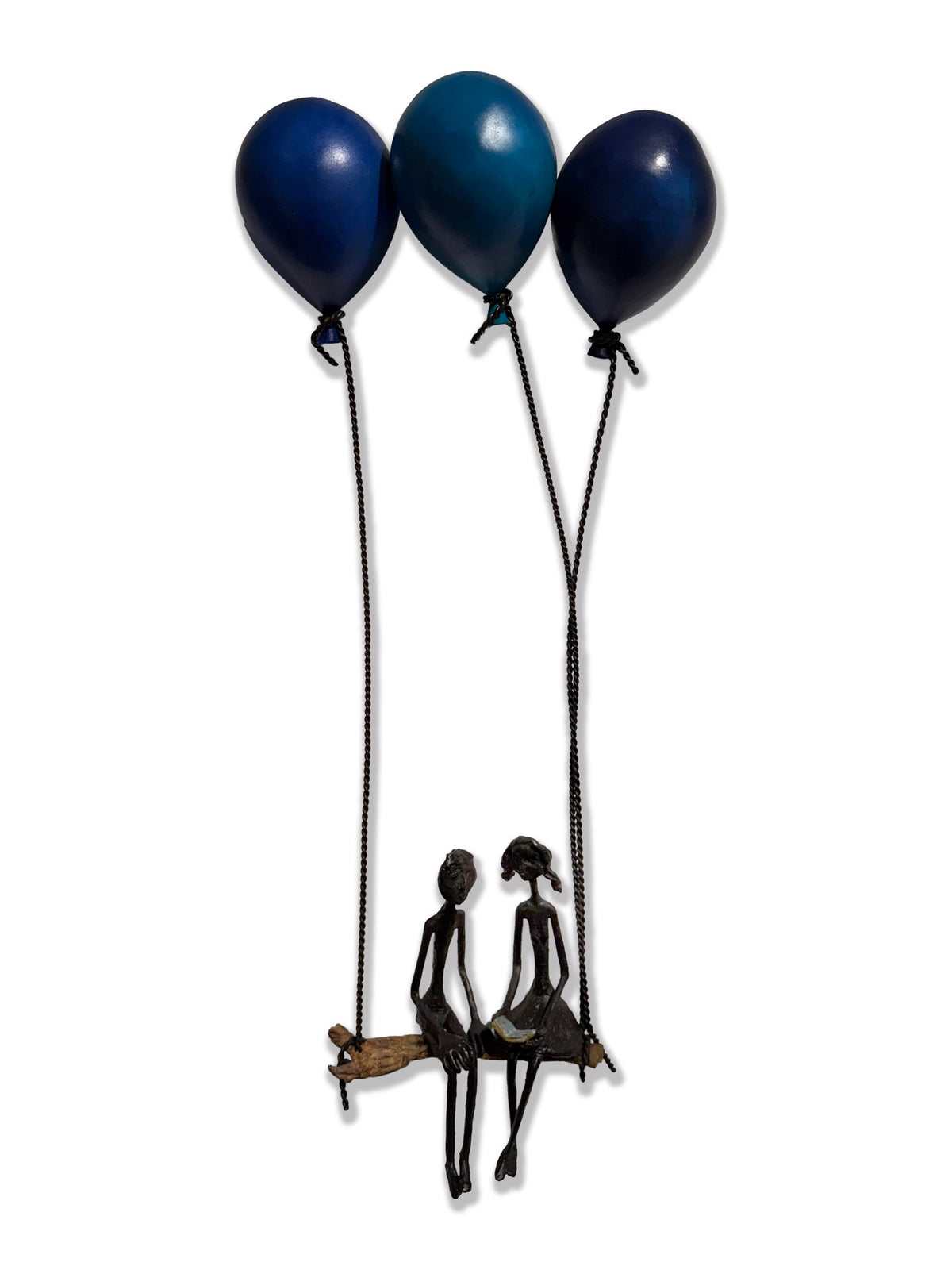 Metal sculpture of two figures on a bench lifted by three blue balloons.