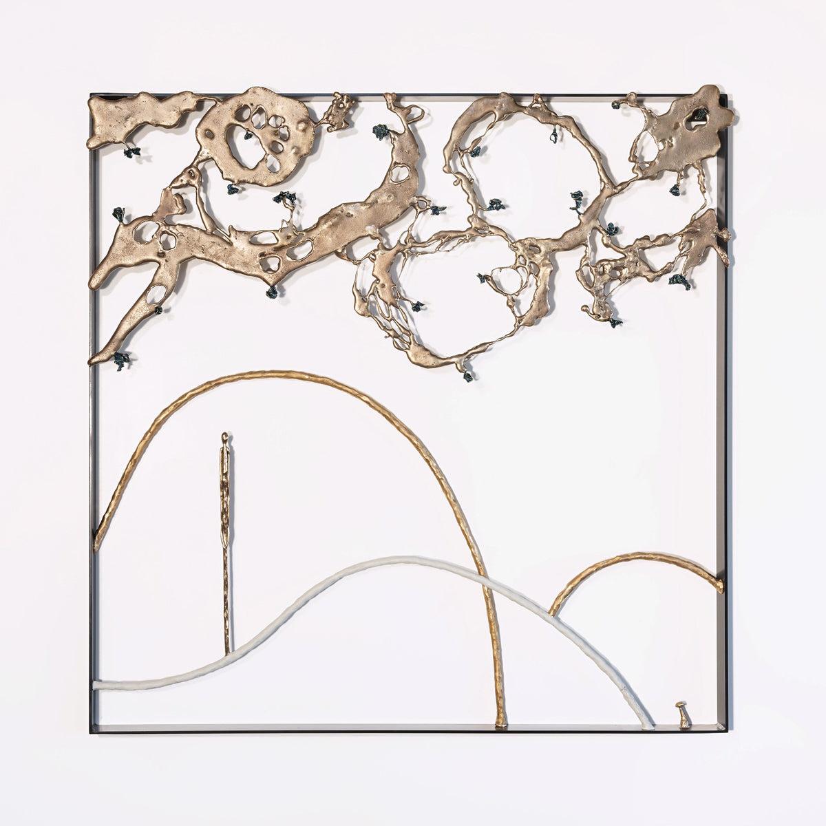 Abstract metal wall sculpture featuring irregular bronze shapes at the top and curved lines at the bottom, mounted within a square black frame on a white background.