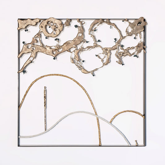 Abstract metal wall sculpture featuring irregular bronze shapes at the top and curved lines at the bottom, mounted within a square black frame on a white background.