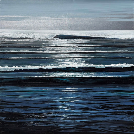 A calm ocean scene with gentle waves reflecting sunlight under a mostly cloudy sky.