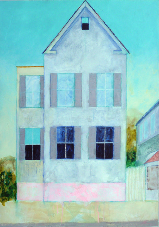 Light blue house with tall windows, shutters, and trees under clear sky.