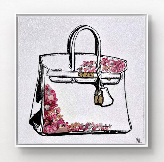 Illustration of a white handbag with gold hardware and pink and red floral accents.