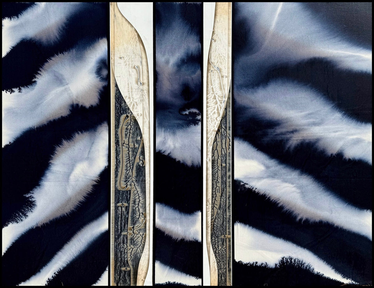 Abstract triptych of dark wavy patterns with light streaks and etched designs on wood.