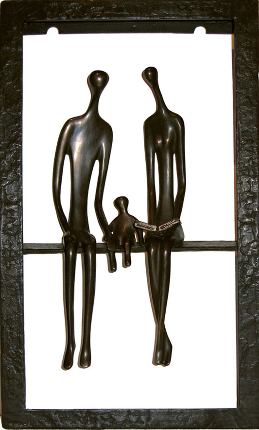 Sculpture featuring two abstract adult figures and a child figure sitting together within a rectangular frame.