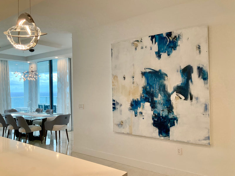 Dixie Purvis large blue and white abstract painting near a dining room with ocean views