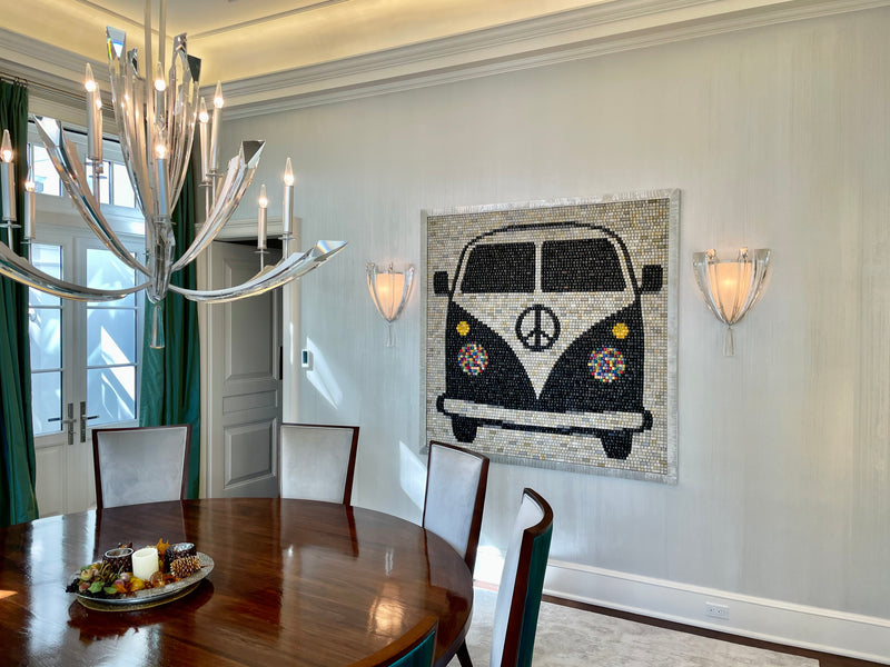 Doug Powell mosaic of a vintage VW bus with a peace sign made from recycled keys, in a formal dining room