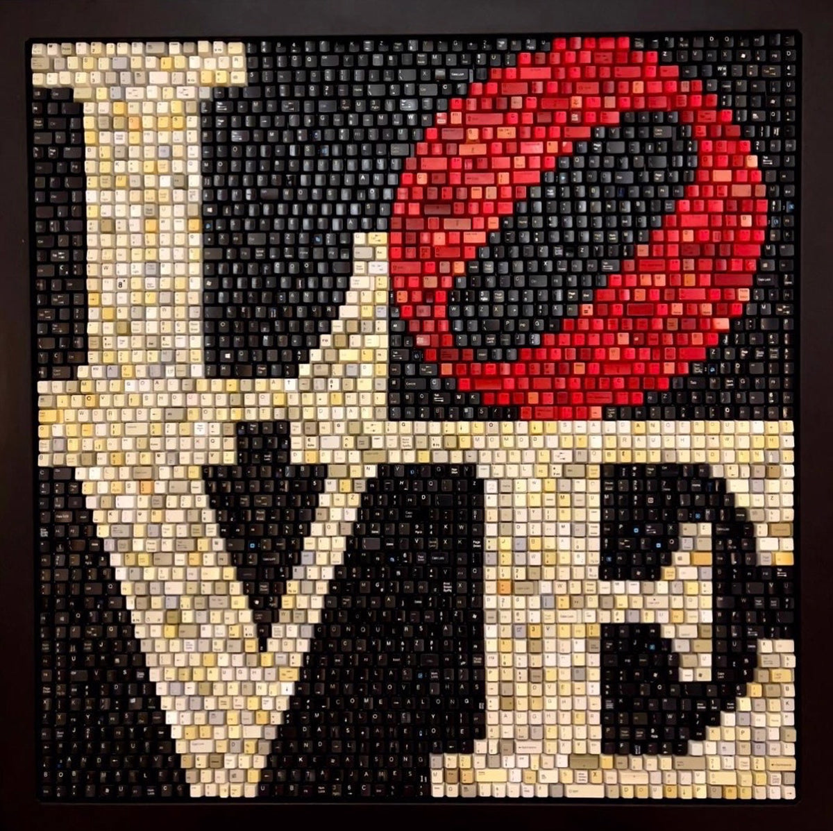 LOVE spelled out using small colored cubes, with a red tilted "O".