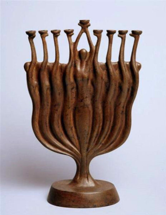 A bronze sculpture resembling a menorah with nine elongated human figures forming the branches and a central figure holding a candle holder.